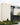 Modern house exterior with white brick facade and large windows