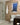 A white bathroom suite, with beige mixed brick slips on the wall and cream mortar between them.