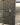 Black brick slips on a feature wall next to a lift, with a black framed window on the other side.