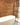 Bathroom with bath and shower with brick slips behind