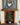 Framed artwork of a lion above a fireplace with a plant inside, clad in brick slips