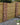 Garden fence with red brick slips