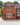 Brick house with white windows and a driveway in front