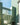 Green glazed brick building with windows on a clear day
