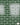 Dark Green Glazed brick slip panel with white mortar