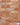 A brick slip panel image, close up of blend 5 - Red and orange with painted blue variations, and grey mortar in the gaps