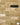 A brick slip panel image, close up of blend 9 - A London Yellow Brick Slip with Black and White, and white mortar in the gaps